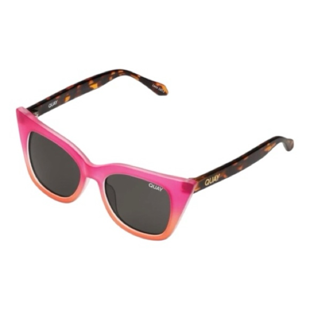 Quay Harper Kids cat-eye sunglasses with  coral pink and smoke lenses.